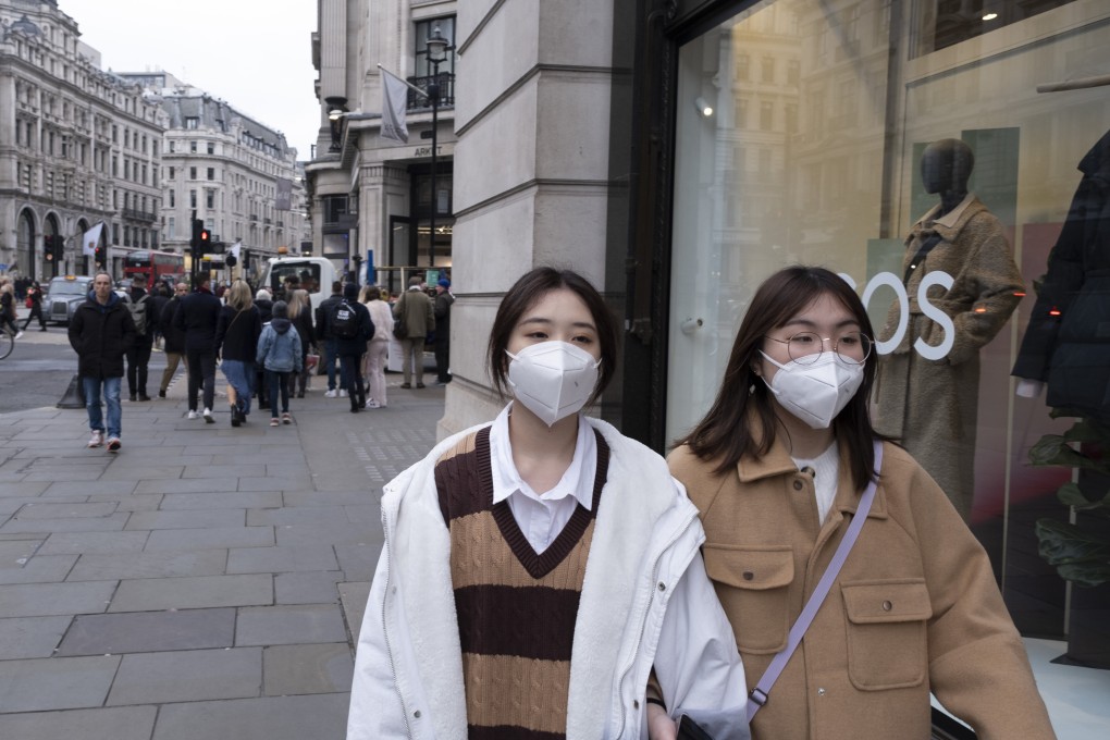 Pedestrians pass a fashion store on London’s Regent Street, a major shopping destination for two centuries but struggling after two years of the pandemic. Photo: Mike Kemp/In Pictures via Getty Images