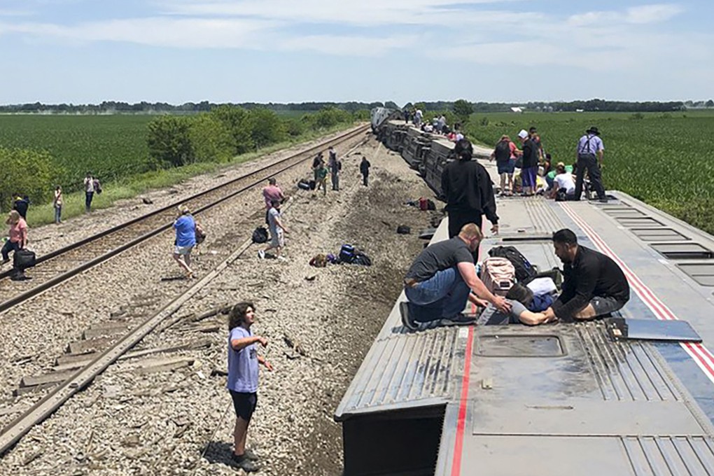 An Amtrak passenger train lies on its side after derailing near Mendon, Missouri, on Monday. Photo: Dax McDonald via AP