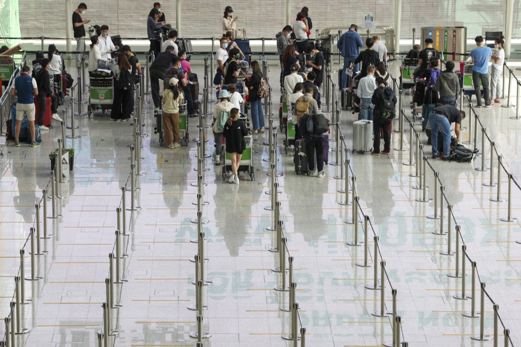 Travellers at Hong Kong International Airport wait to be transported to their quarantine facilities. Photo: Yik Yeung-man