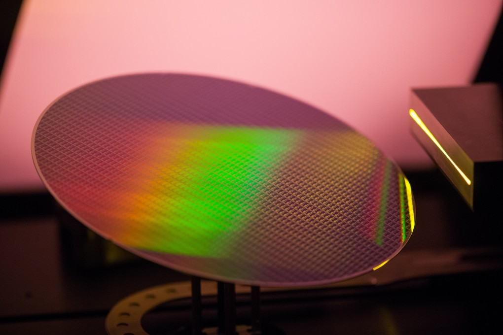 A 200-millimetre silicon wafer in a lithography scanner is seen during production at the X-Fab Silicon Foundries SE semiconductor plant in Corbeil-Essonnes, France, on June 1, 2021. Taiwan’s GlobalWafers plans to build a new plant in Texas after a failed European investment. Photo: Bloomberg