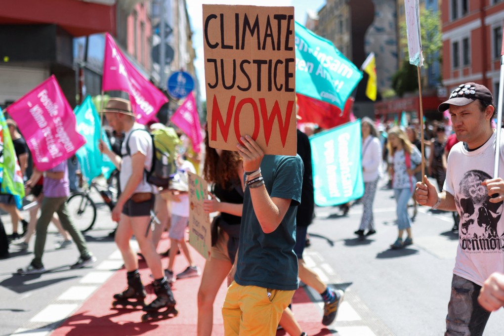 A demonstrator holds a sign during a protest in Munich on June 25 ahead of the Group of 7 leaders’ summit in the Bavarian alpine resort of Elmau Castle. Photo: Reuters