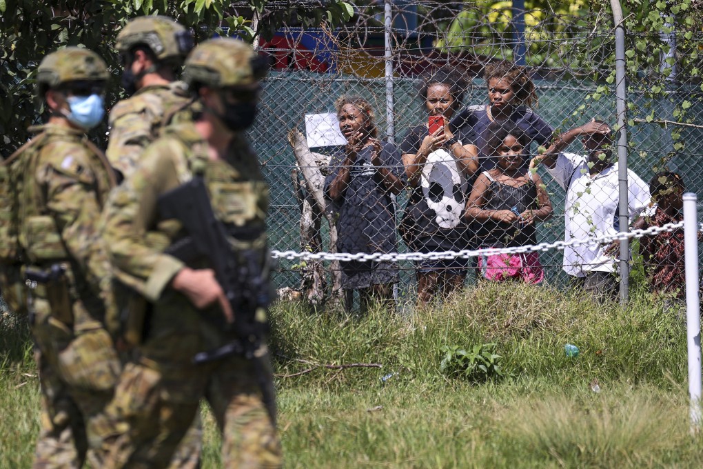 Australian soldiers and police patrol the streets of Honiara, capital of the Solomon Islands, in November after a spate of violence and unrest. Photo: Gary Ramage via AP