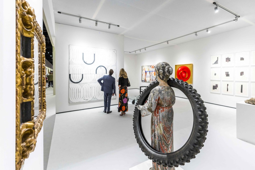 Visitors look at exhibits during the 35th edition of The European Fine Art Fair in Maastricht, Netherlands, on Tuesday. Photo: ANP/AFP