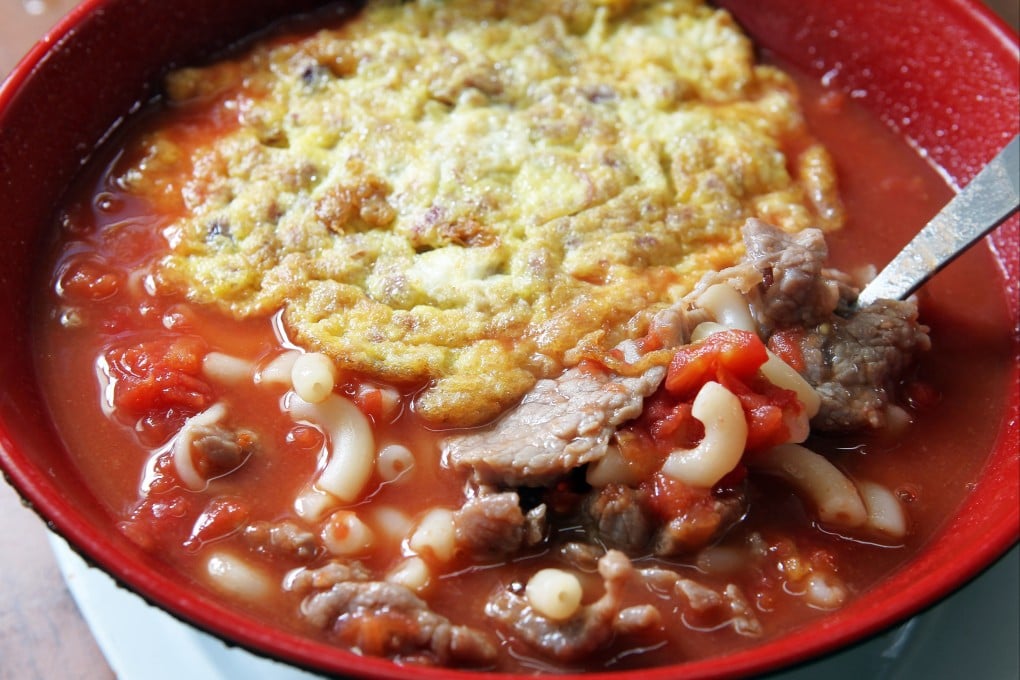 Tomato broth macaroni with luncheon meat and fried egg at Sing Heung Yuen in Central - a place that food marketer Deanna Chuang says visitors to the city simply have to visit. Photo: SCMP