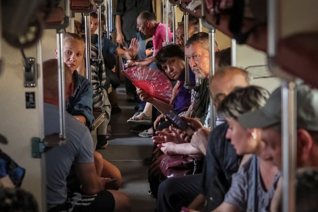 People sit on a train to Dnipro and Lviv during an evacuation effort from war-affected areas of eastern Ukraine on June 18. Photo: Reuters