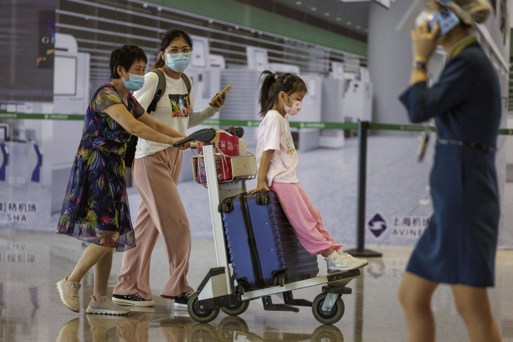 Travelers at Shanghai’s Hongqiao International Airport on Wednesday, as China announces it will no longer indicate in domestic travel passes whether a person has recently been to a city with high risk of Covid-19 transmission. Photo: EPA-EEE