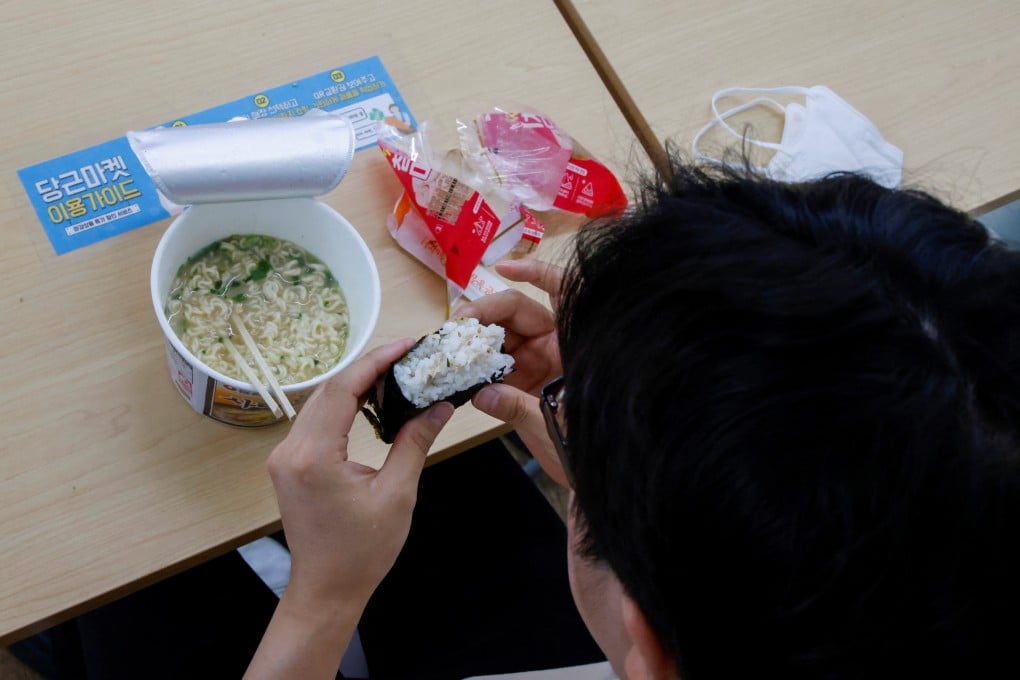 An office worker eats his lunch at a convenience store in Seoul earlier this month. Photo Reuters