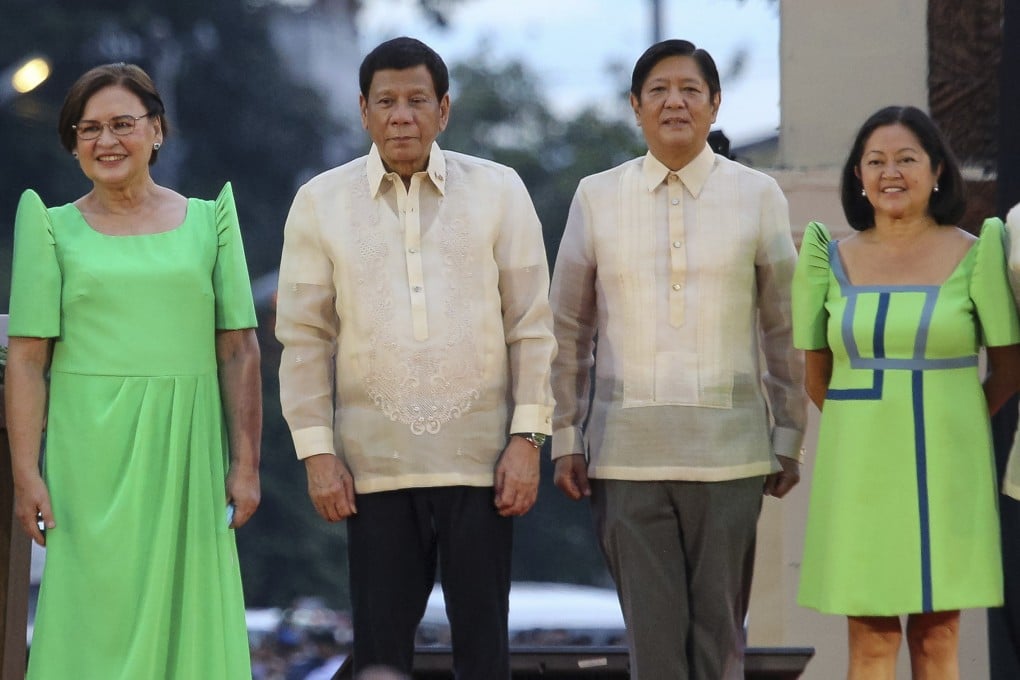 Outgoing Philippine President Rodrigo Duterte, second from left, will leave Marcos Jnr a national debt burden of 13 trillion pesos. Photo: AP