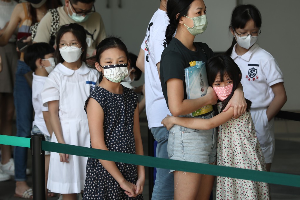 Adults and children stand in a queue for vaccination at the Hong Kong Children’s Hospital in Ngau Tau Kok on April 28. Photo: Jonathan Wong