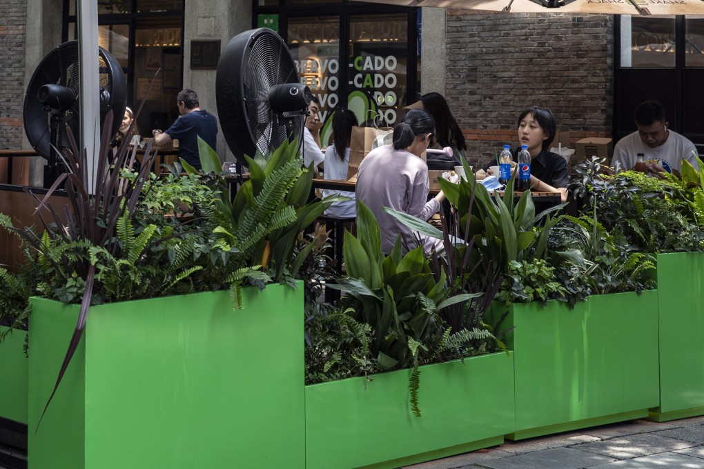 Customers at a Shake Shack restaurant in Shanghai on June 29. Lingering Covid-19 restrictions are making recovery more challenging for the service sector. Photo: Bloomberg