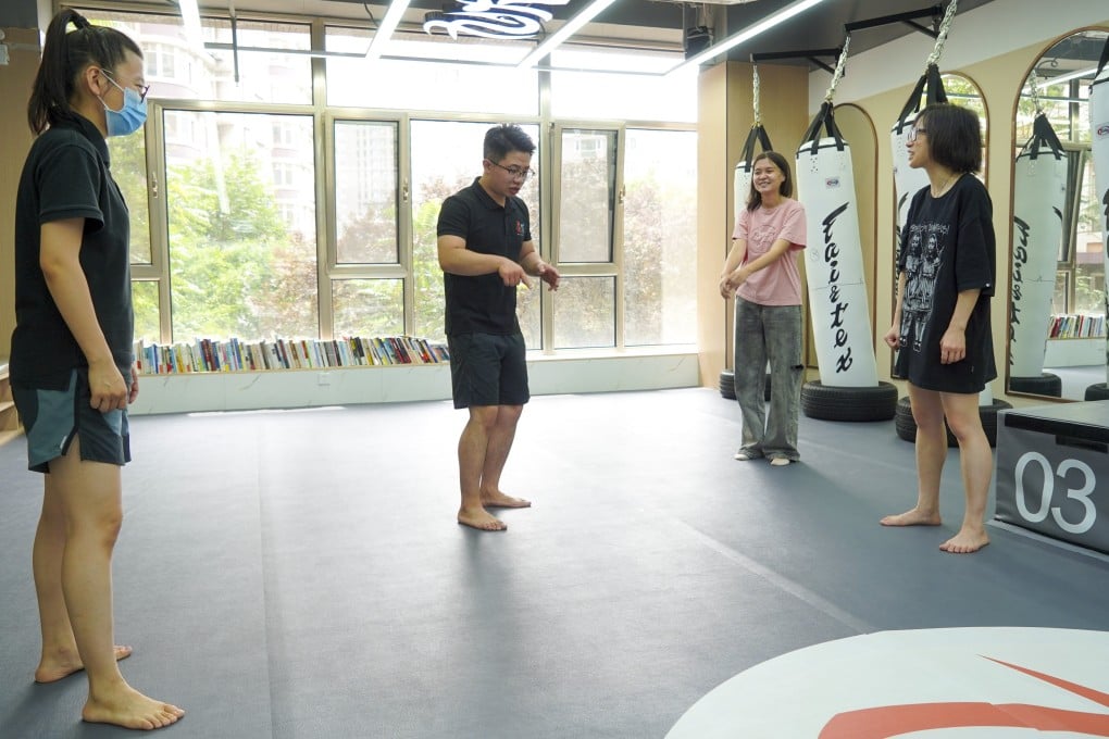 Women take a self-defence class at Jiufu Boxing in Beijing on Friday. Photo: Tom Wang