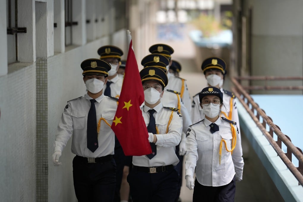Hong Kong secondary school students at a Chinese national flag-raising ceremony on Thursday to mark the 25th anniversary of the former British colony’s handover. Photo: AP