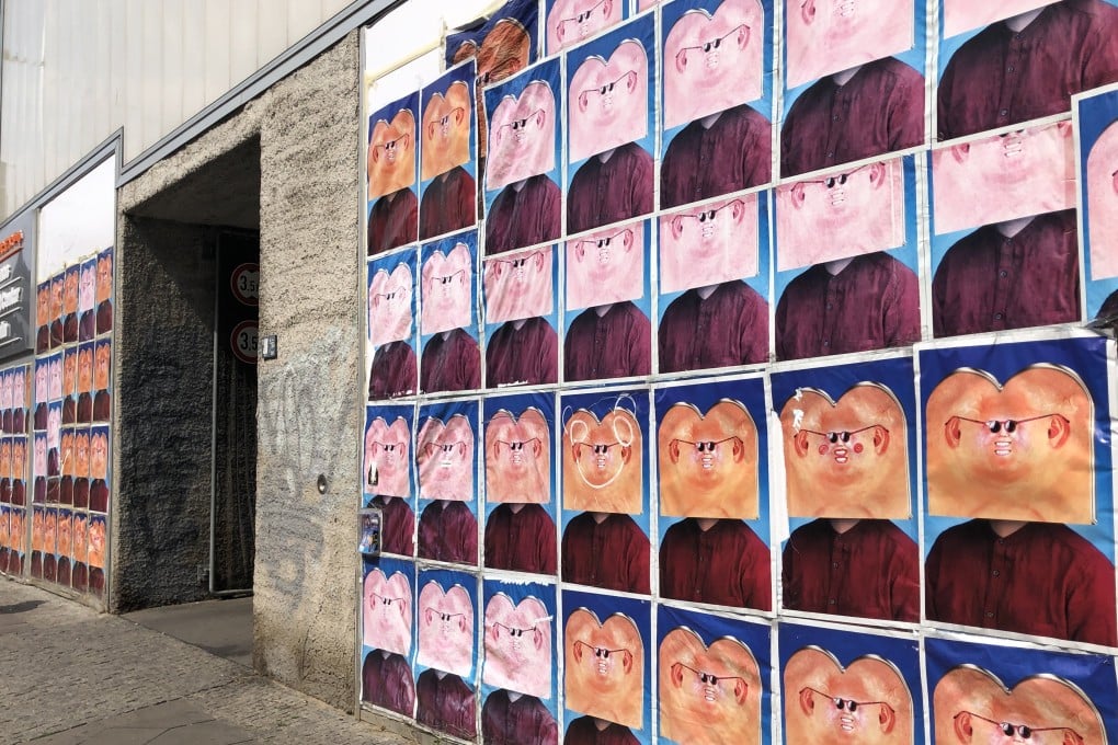 For its final exhibition, Times Art Center Berlin had artist Wong Ping cover its frontage in posters of himself in disguise. The art space has closed after four years. Photo: Enid Tsui