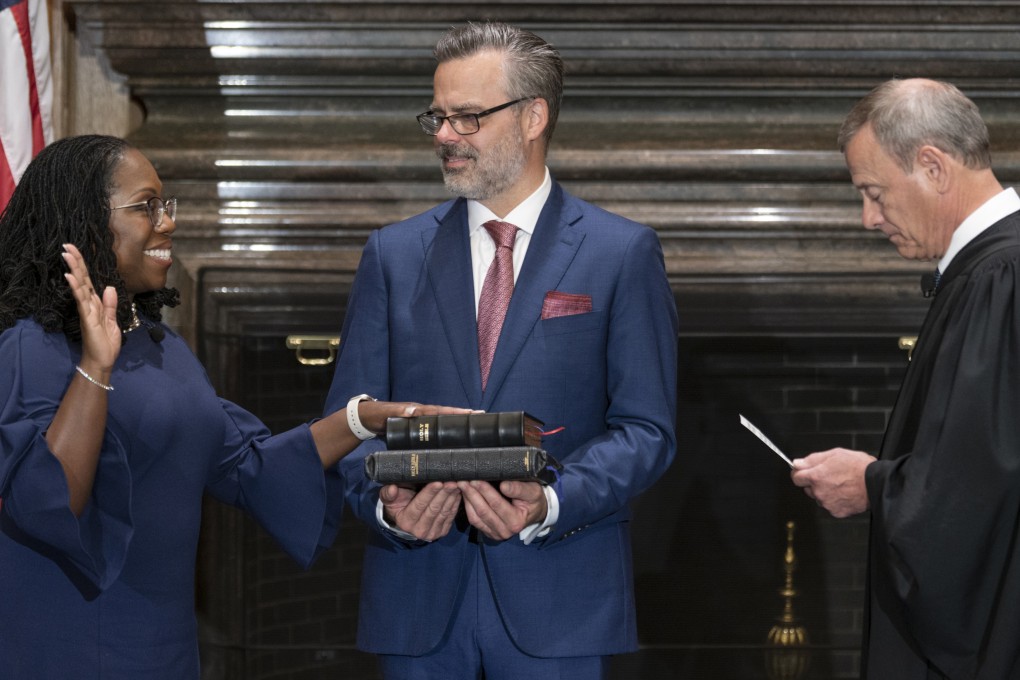 US Chief Justice John Roberts administers the Constitutional Oath to Ketanji Brown Jackson as her husband Patrick Jackson holds the Bible at the Supreme Court in Washington on Thursday. Photo: US Supreme Court via AP