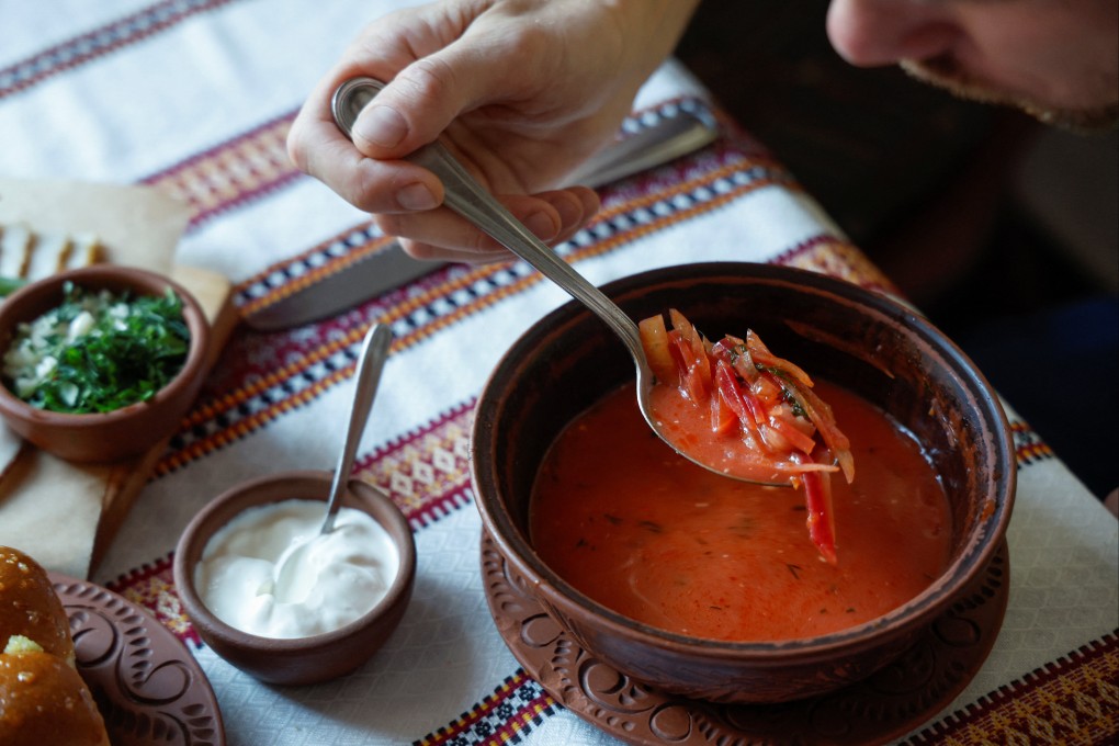 A man has a bowl of borscht at a restaurant in Kyiv on Friday, as Russia’s attack on Ukraine continues. Photo: Reuters