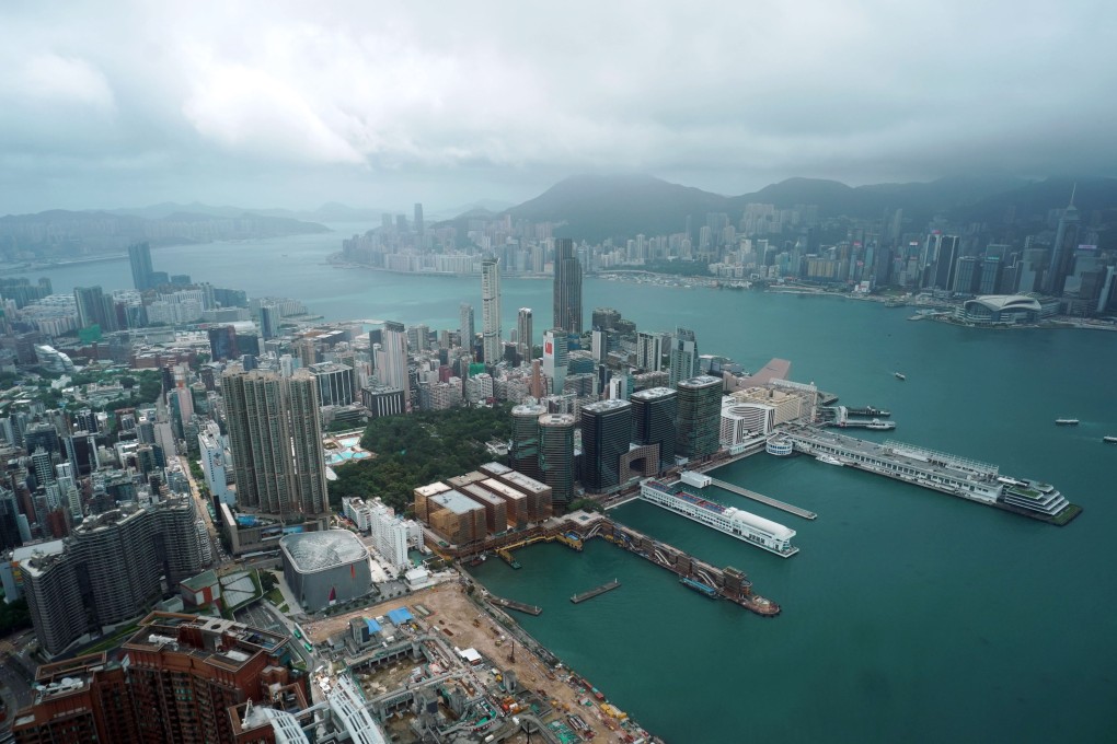 Clouds remain over Victoria Harbour amid a No 1 typhoon warning signal. Photo: Felix Wong