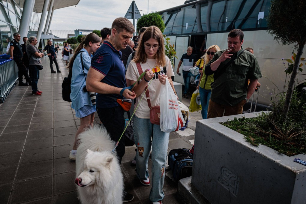 Staff from Russia’s diplomatic mission and their families arrive at Sofia airport prior to their departure on July 3. Bulgaria expelled 70 Russian diplomatic staff, the EU country’s prime minister announced on June 28, the biggest number ordered out in one-go from the Balkan nation. Photo: AFP