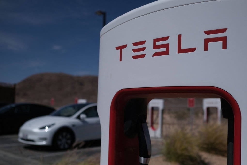 Tesla cars sit at charging stations in Yermo, California. Photo: AFP