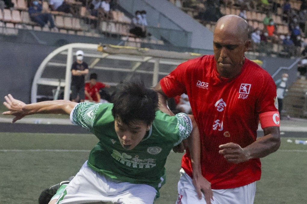 Sha Tin captain Fabio Lopes challenges for the ball against Wofoo Tai Po at Kowloon Bay Park. Photo: Dickson Lee
