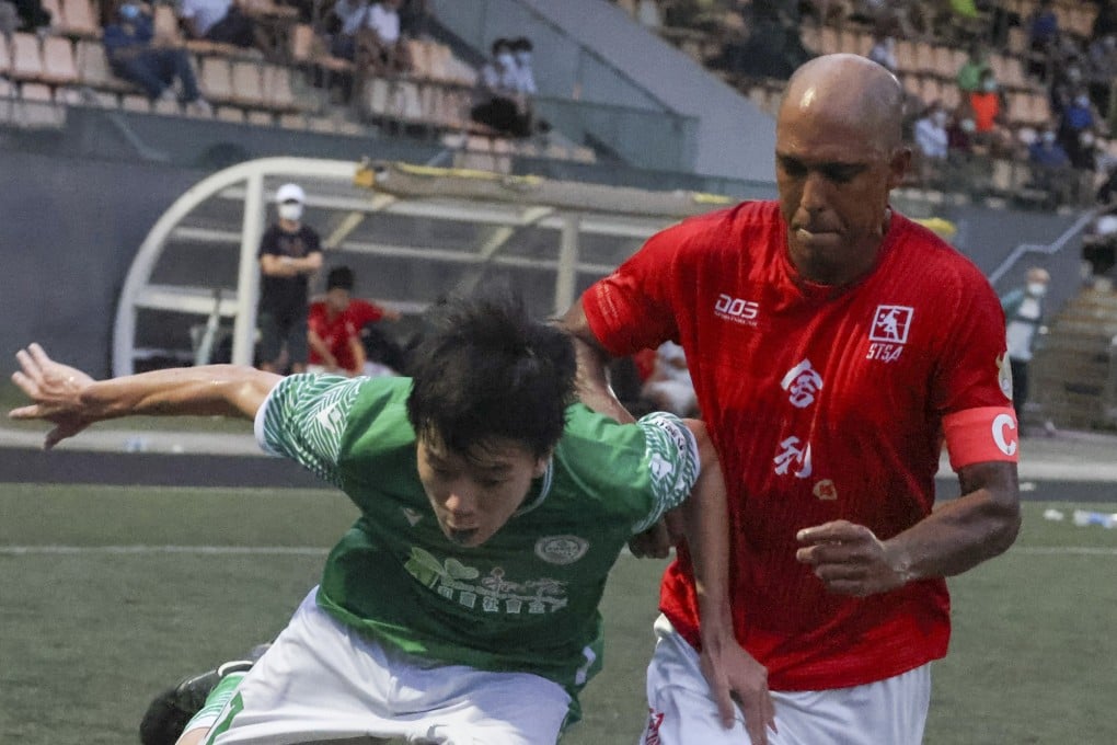 Sha Tin captain Fabio Lopes challenges for the ball against Wofoo Tai Po at Kowloon Bay Park. Photo: Dickson Lee