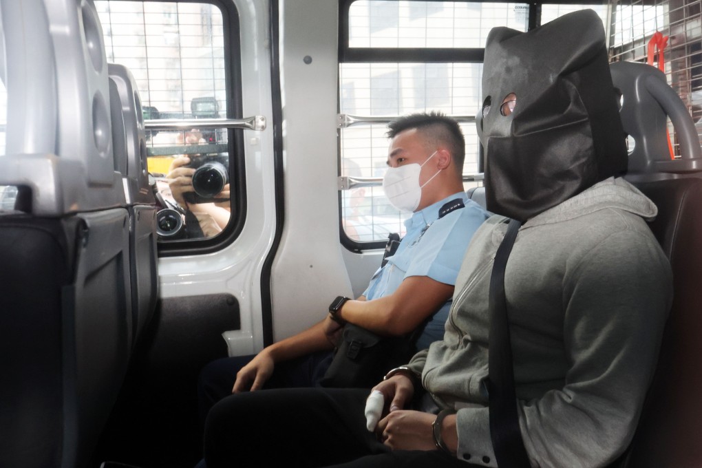 Police escort Alex Lo, 28, to Kowloon City Court. Photo: Edmond So