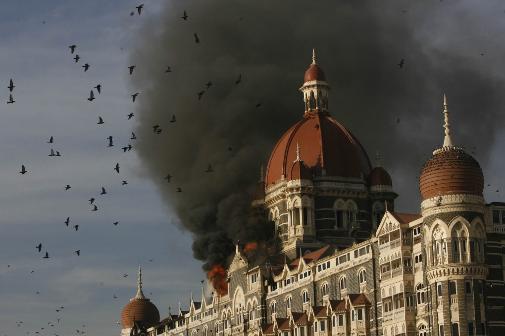 The Taj Hotel burns from an attack that killed multiple people in Mumbai, on November 27, 2008. File photo: AP
