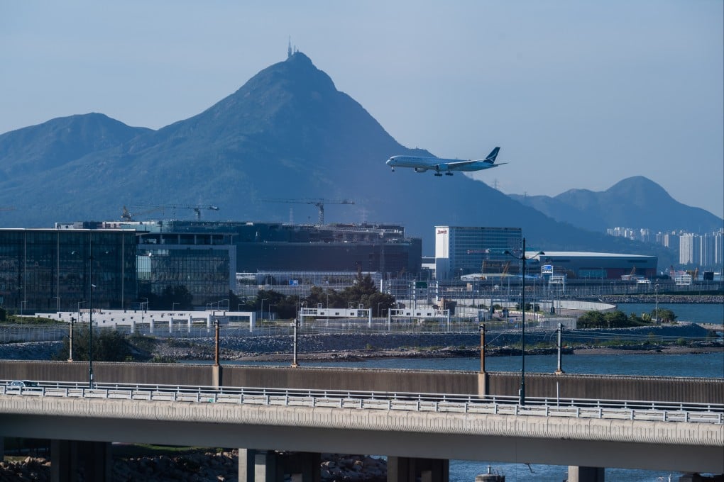 An aircraft operated by Cathay Pacific lands at Hong Kong International Airport on June 24. Reopening to international travel is low-hanging fruit for the new administration. Photo: Bloomberg
