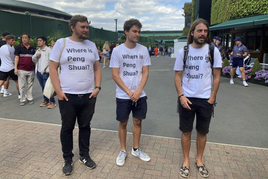The spectators wearing their T-shirts at Wimbledon in London on Monday. Photo: AP
