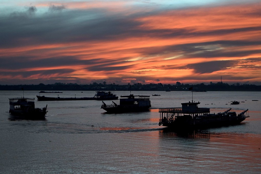 Ferries take passengers and vehicles across the Mekong River in Phnom Penh, Cambodia. Photo: AFP