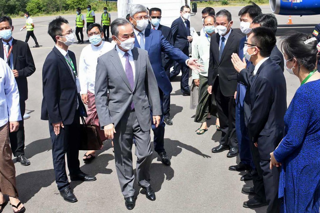 Chinese Foreign Minister Wang Yi, centre, is welcomed by Myanmar Foreign Ministry representatives and Chinese embassy officials upon his arrival at Nyaung Oo Airport in Bagan, Myanmar, on July 2. Photo: AP
