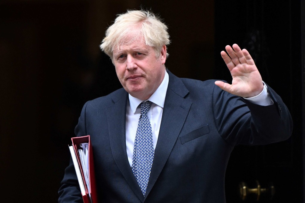 Britain’s Prime Minister Boris Johnson waves as he leaves No 10 Downing Street in central London on Tuesday. Photo: AFP