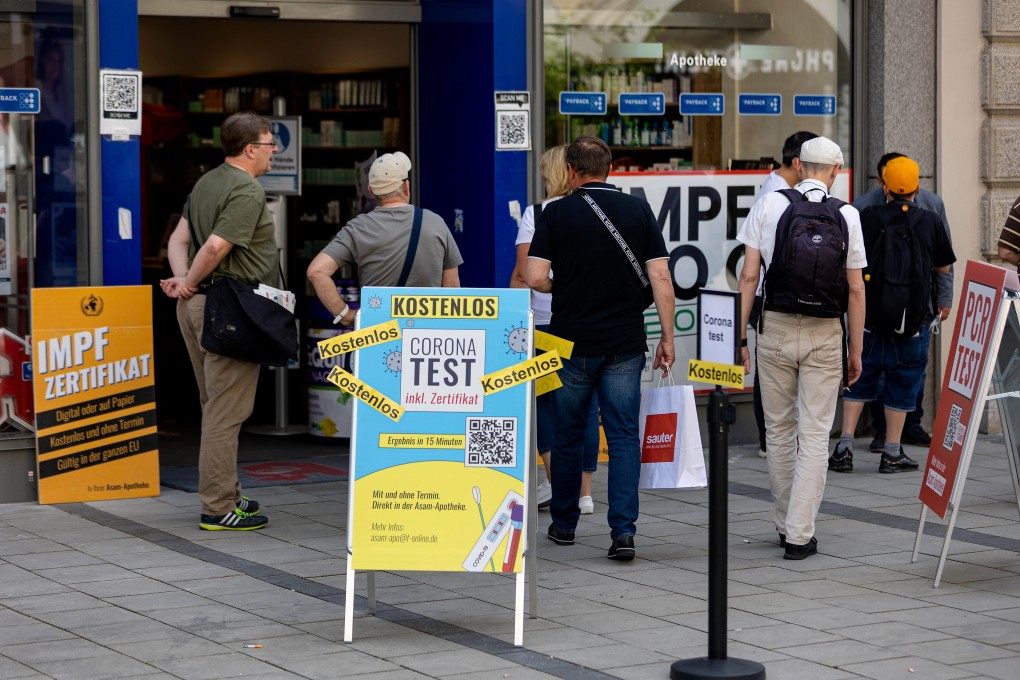 Members of the public wait in line outside a Covid-19 testing site in Munich, Germany in June. Photo: Bloomberg