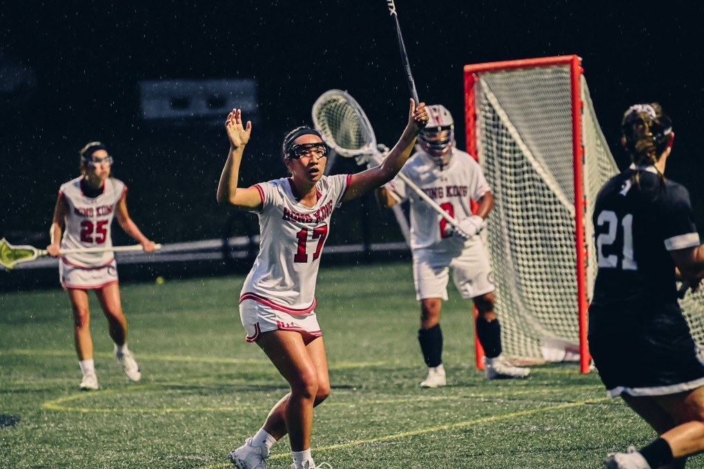 Hong Kong trio (from left to right) Liu Hui-yan (25), Vickie Tse (17) and goalie Liu Hiu-tan guard against the threat of New Zealand’s Sarah Butler during their consolation bracket match at the World Lacrosse Women’s Championship. Photo: Handout