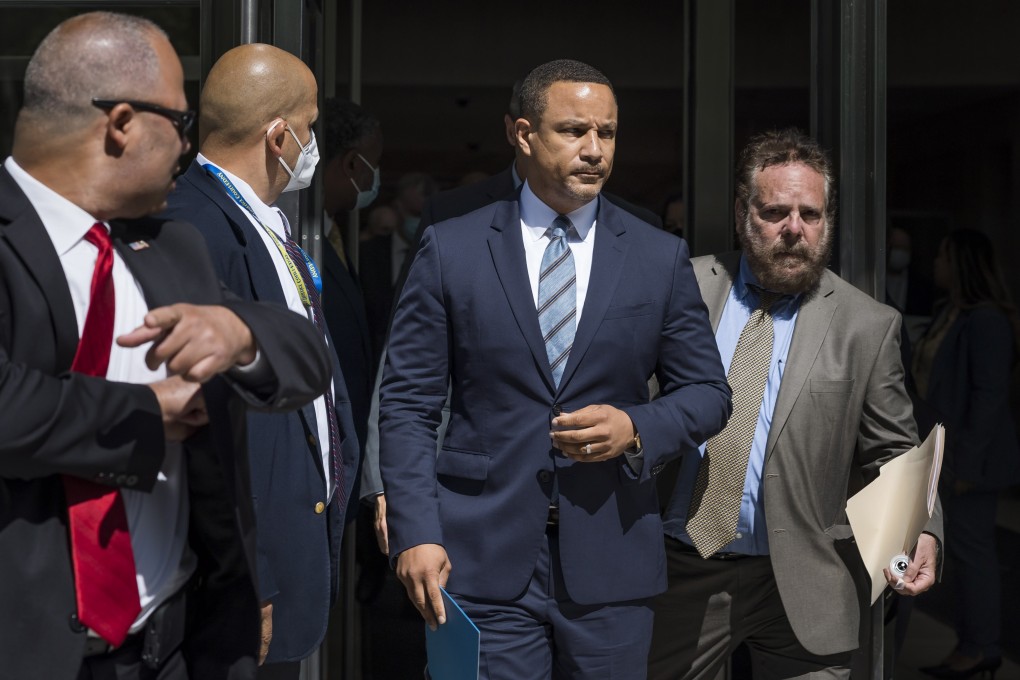 Breon Peace (centre), US Attorney for the Eastern District of New York,  outside the courthouse in Brooklyn. Peace says his office will always work to root out corrupt officials. Photo: EPA-EFE