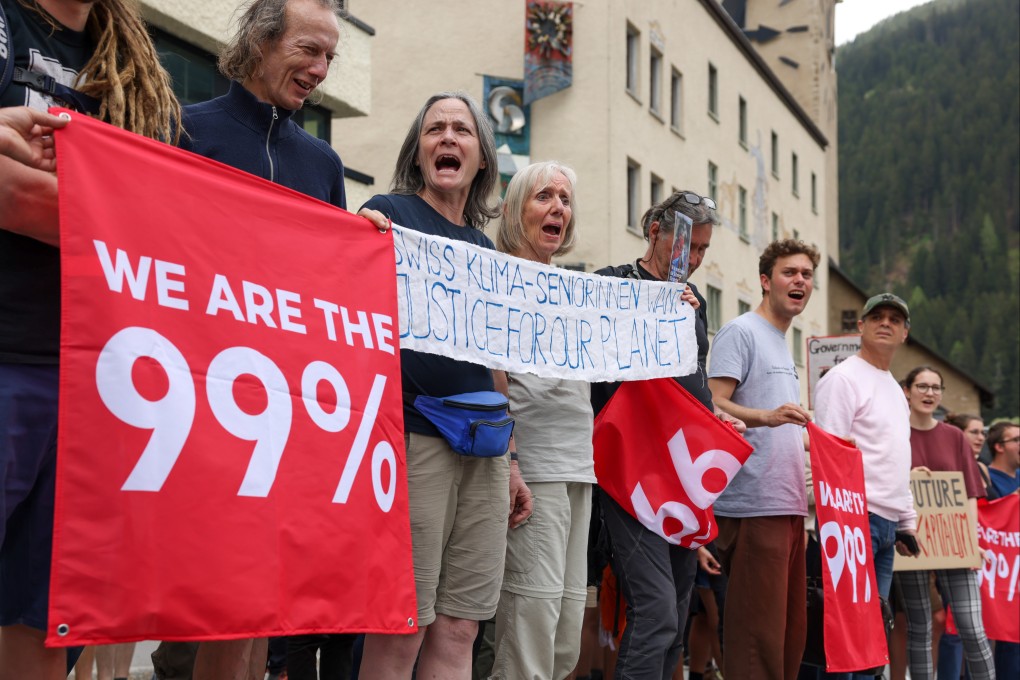 Protesters in Davos, Switzerland, on May 22 ahead of the annual WEF meeting. Better public-private coordination is needed to tackle collosal challenges, ranging from climate change and pandemic preparation to infrastructure shortages and supply chain repair. Photo: Bloomberg