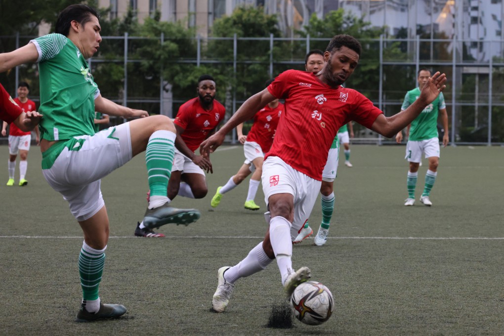 Cheung Chi-yung (left) of Wofoo Tai Po challenges Pascal Tolno of Sha Tin in a First Division League Cup semi-final at Kowloon Bay Park. Tai Po won 1-0 to reach the final. Photo: Dickson Lee