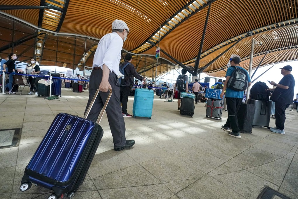 Outbound travellers wait to be screened for Covid-19 at the Hong Kong-Zhuhai-Macau Bridge. Photo: Felix Wong