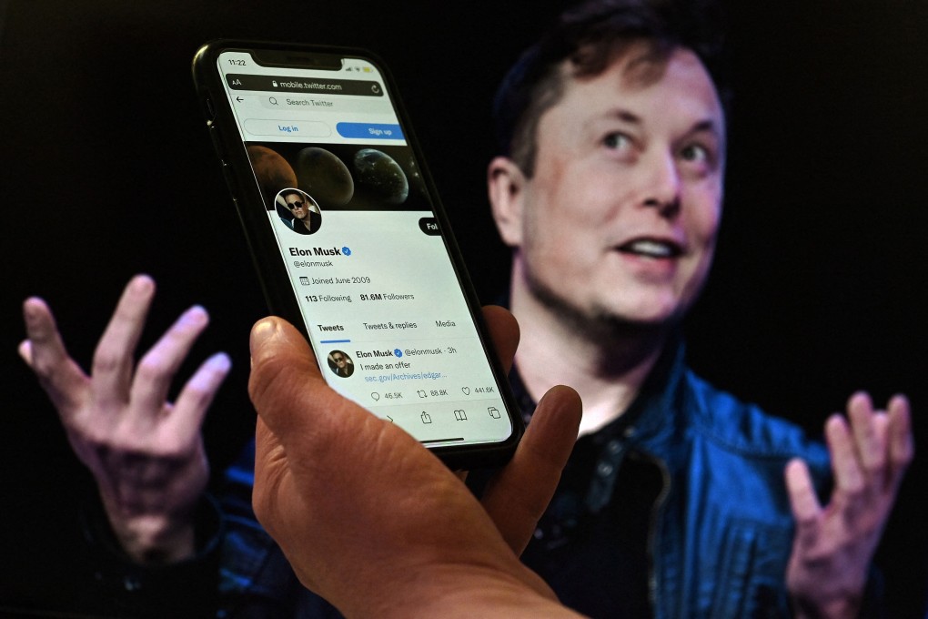 In this file photo illustration, a phone screen displays the Twitter account of Elon Musk with a photo of him shown in the background on April 14, 2022. Photo: AFP