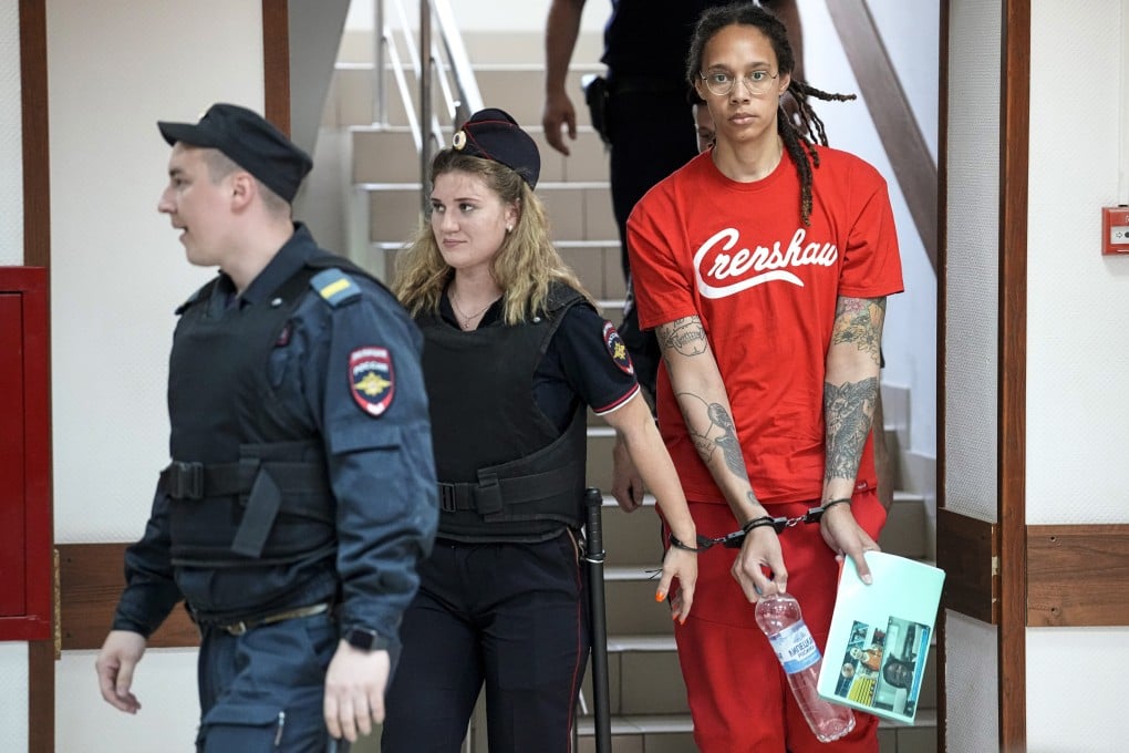 WNBA star and two-time Olympic gold medalist Brittney Griner is escorted to a courtroom in Khimki, just outside Moscow, on Thursday. Photo: AP