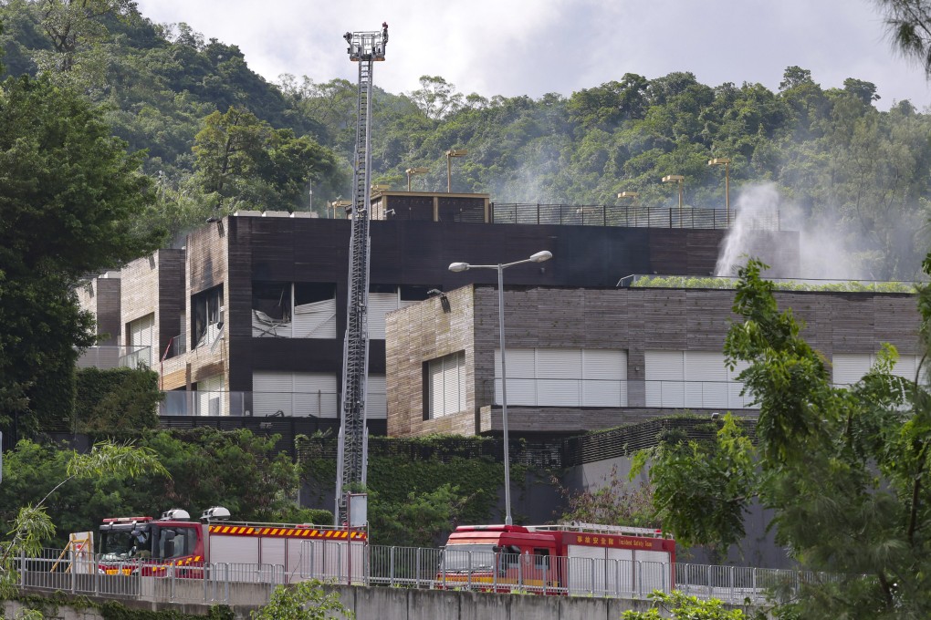 Fire crews battle a blaze at a luxury Hong Kong home owned by ex-screen goddess Brigitte Lin and her billionaire husband Michael Ying. Photo: Jelly Tse.