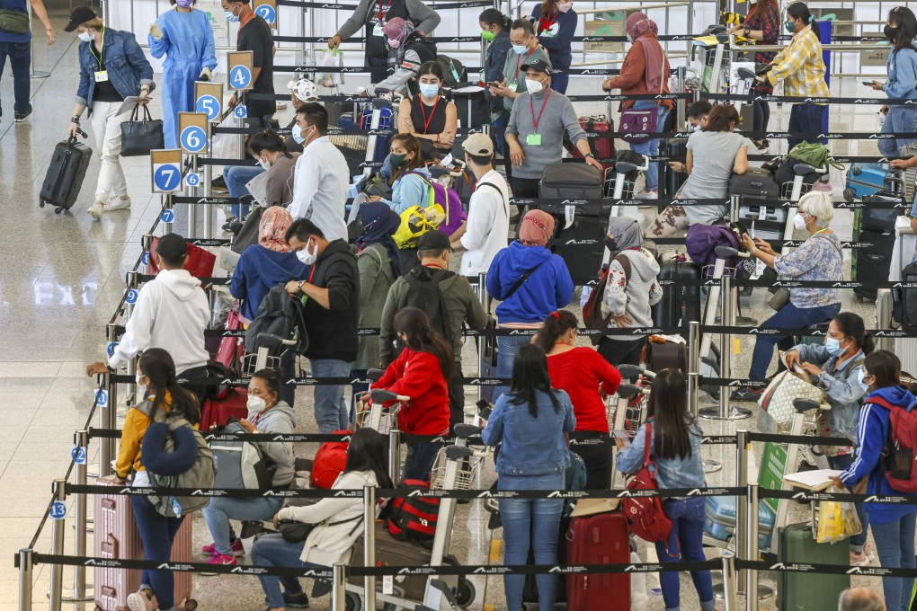 Arrivals at Hong Kong’s airport. The city has one of the toughest quarantine systems in the world. Photo: K. Y. Cheng