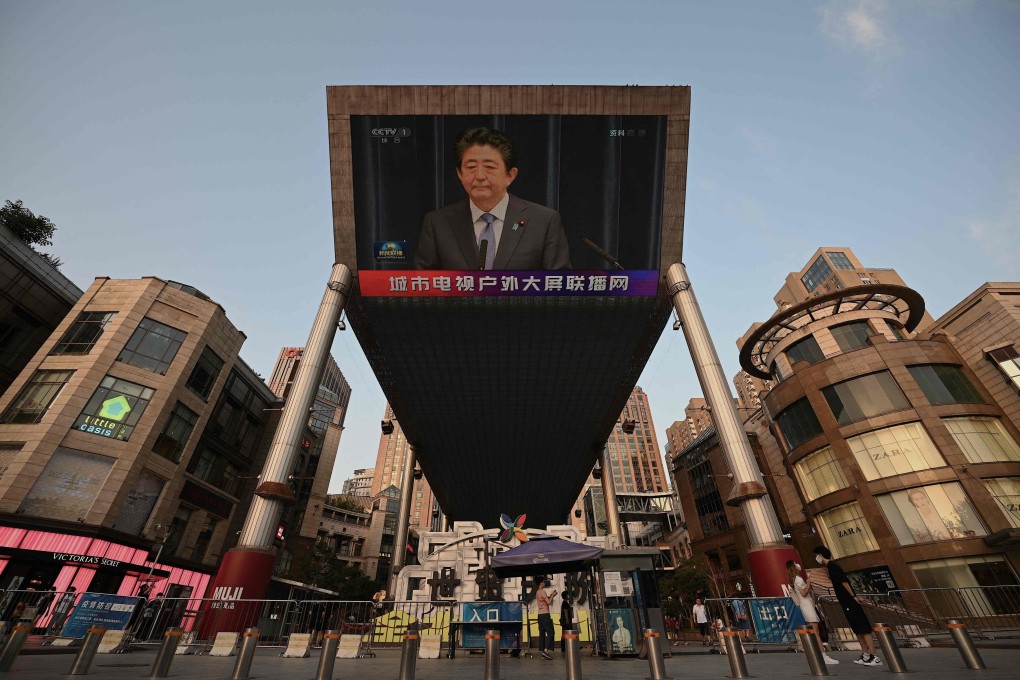 A video screen in Beijing shows news of former Japanese prime minister Shinzo Abe. Photo: AFP