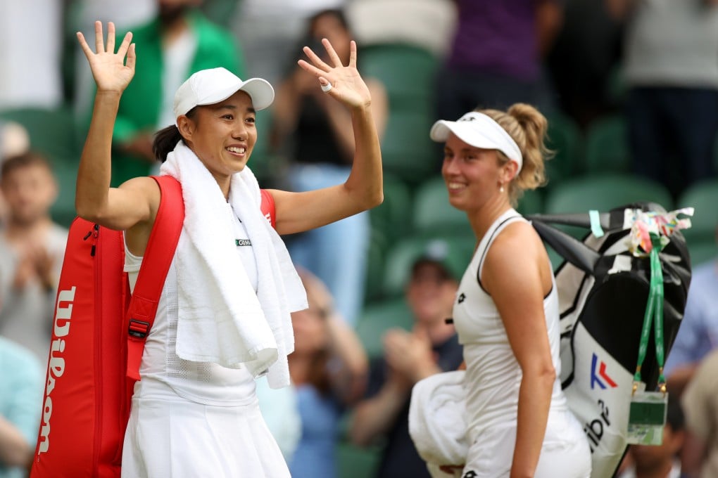 Zhang Shuai of China waves to the spectators as Elise Mertens of Belgium looks on after they won their women’s doubles semi-final at Wimbledon. Photo: Xinhua