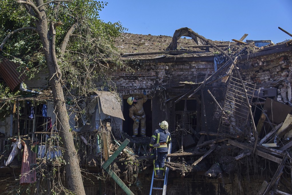 Firefighters inspect a building destroyed by shelling in Kharkiv, Ukraine. Photo: EPA-EFE