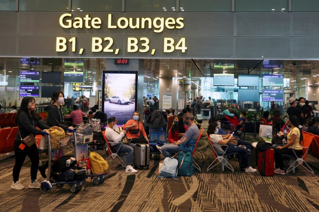 Travellers wait to embark at Singapore’s Changi Airport. Demand is soaring among Singaporeans for holidays abroad. File photo: Reuters