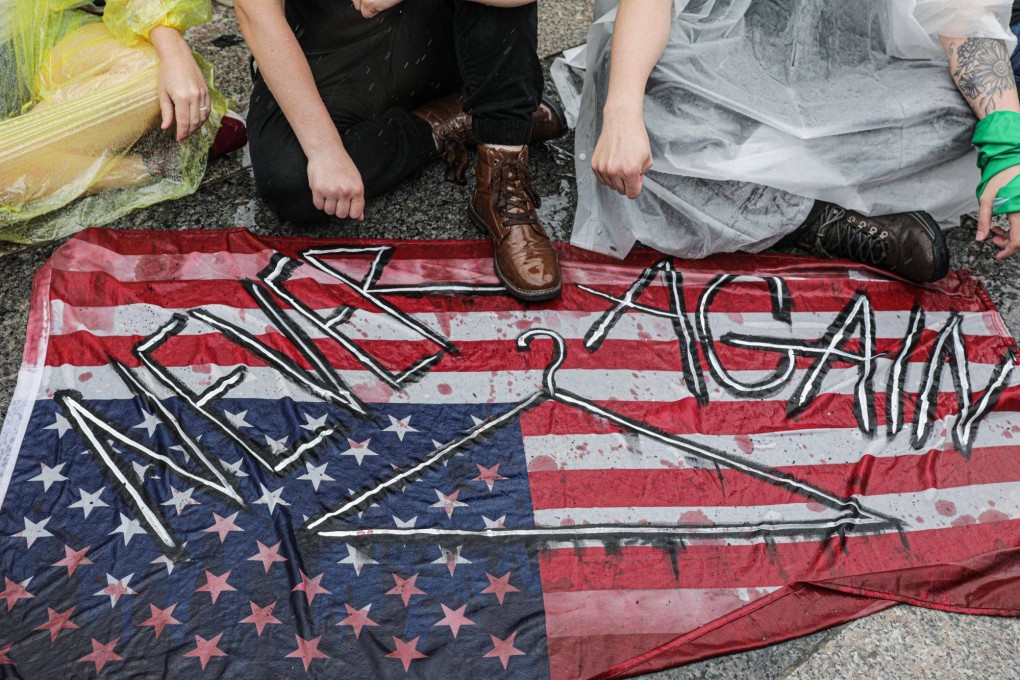Demonstrators hold a sit-in in front of the White House during a Women’s March rally in Washington, D.C., US, on Saturday. President Biden on Friday signed an executive order intended to preserve access to abortion following last month’s Supreme Court’s decision to overturn Roe v. Wade. Photo: Bloomberg