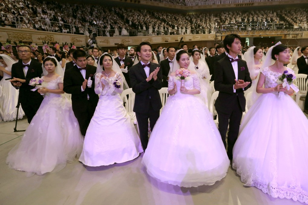 Couples attend a mass wedding ceremony organised by the Unification Church in South Korea. File photo: AP
