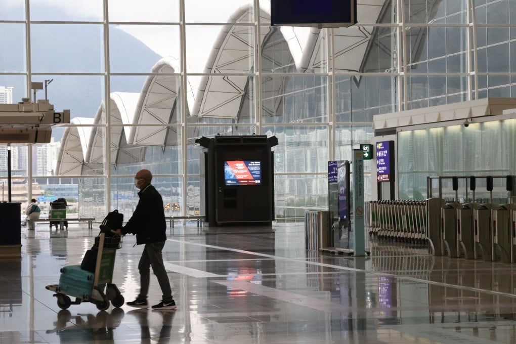 A man enters the departure terminal at Hong Kong International Airport on March 29, 2022. Photo: SCMP / K. Y. Cheng