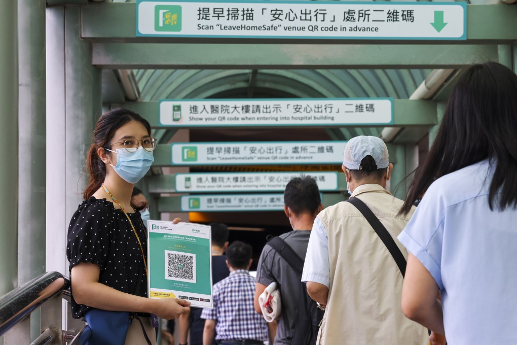 Residents are required to scan the “Leave Home Safe” app when entering certain premises. Photo: Nora Tam