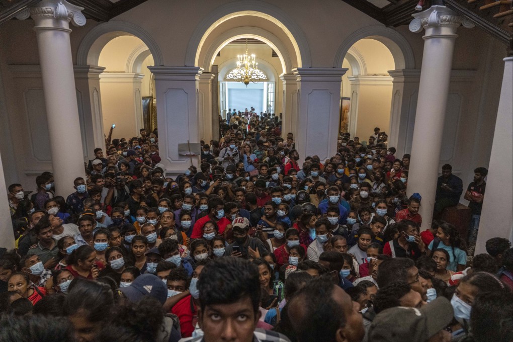 Protesters throng President Gotabaya Rajapaksa’s official residence in Colombo for a second day on Monday. Photo: AP